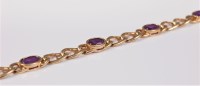 Lot 2671 - A 9ct amethyst bracelet, the six oval...
