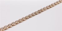 Lot 2673 - A 9ct diamond bracelet, the small round...