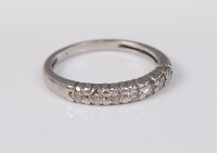 Lot 2677 - A diamond half hoop eternity ring, the round...