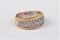 Lot 2697 - An bi-coloured 18ct diamond ring, the three...