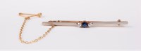 Lot 2731 - A three stone sapphire and diamond bar brooch,...