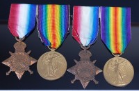Lot 1014 - Two WW I 1914-15 Star and Victory duos, naming...