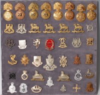 Lot 1095 - A collection of assorted cap badges and...