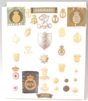 Lot 1113 - A collection of Danish cap, cloth and collar...