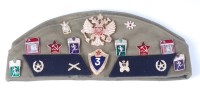 Lot 1118 - A Russian side cap adourned with various cloth...