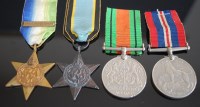 Lot 1141 - A WW II group of four to include Atlantic Star...