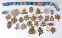 Lot 1267 - A collection of assorted military cap badges...