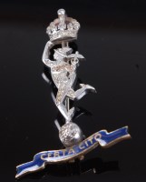 Lot 1296 - An unmarked white, yellow metal and enamelled...