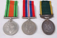 Lot 1345 - A group of three medals to include WW II...