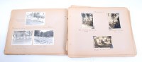 Lot 1386 - A WW II period photograph album, contents...