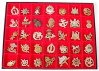 Lot 1404 - A large collection of cap badges to include...