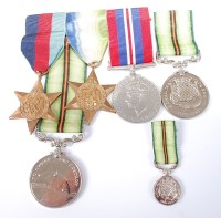 Lot 1422 - A group of four medals to include WW II...