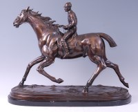 Lot 1501 - A large bronze of a racehorse with jockey up,...