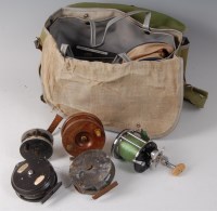 Lot 1547 - A fishing bag and contents to include a Penn...