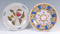 Lot 17 - An 18th century Delft charger, polychrome...