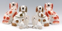 Lot 26 - A pair of Staffordshire spaniels, each having...