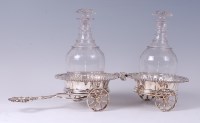 Lot 2088 - An Old Sheffield Plate twin coaster wine wagon,...
