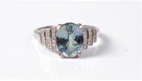 Lot 2148 - A tanzanite and diamond ring, the oval...