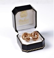 Lot 2156 - A pair of 9ct knot earrings, the knotted...