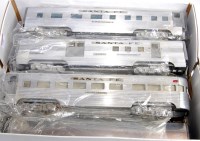 Lot 554 - American model toys 7 coach rake of unpainted...
