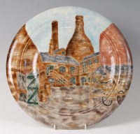 Lot 193 - A Cobridge stoneware Cobbled Court charger,...