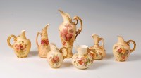 Lot 1036 - A Royal Worcester blush ware pair flat back...