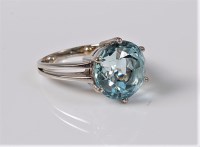 Lot 1179 - A single stone aquamarine ring, the round...