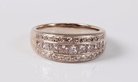 Lot 1221 - An 18ct three row diamond ring, the two outer...