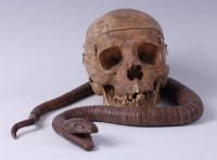 Lot 1243 - A human skull, of considerable age, with both...