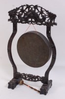Lot 1303 - A circa 1900 Chinese carved hardwood gong...