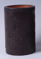 Lot 1304 - A Chinese well-carved bamboo brush pot, the...