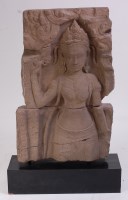 Lot 1312 - A South East Asian carved sandstone stele,...