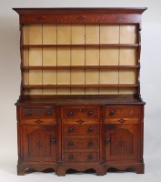 Lot 1466 - A George III oak dresser, the three-tier...