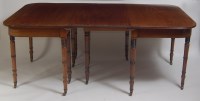 Lot 1472 - A George III mahogany double D-end dining...