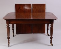 Lot 1474 - An antique mahogany extending dining table, in...
