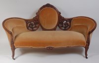 Lot 1488 - A Victorian walnut showframe sofa, upholstered...