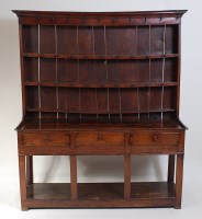 Lot 1507 - A George III oak dresser, having a three...
