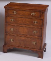 Lot 1513 - A figured walnut and walnut bachelors chest,...
