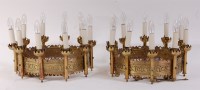 Lot 1514 - A pair of cut brass ten-light ceiling pendants,...