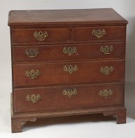 Lot 1518 - A George III oak squarefront chest, of two...
