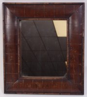 Lot 1521 - An oyster veneered cushion framed wall mirror,...