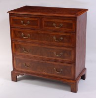 Lot 1523 - A figured walnut and inlaid chest, in the...
