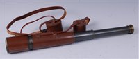 Lot 99 - An early 20th century brass and leather clad...