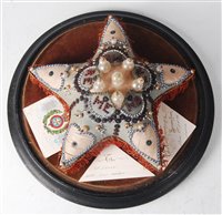 Lot 157 - A WW I sweetheart pin cushion, of star shape...