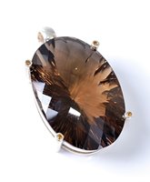 Lot 2503 - A smokey quartz and citrine pendant, the large...
