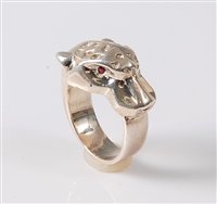 Lot 2667 - A panther ring, the stylised panther head with...
