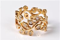 Lot 2296 - An 18ct diamond 'floral sprig' ring, the...