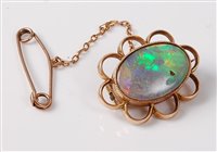 Lot 2237 - A 15ct opal brooch, the oval opal cabochon in...