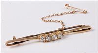 Lot 2313 - A four stone diamond bar brooch, the four...
