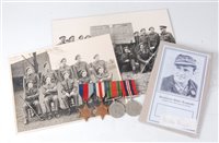Lot 330 - A group of four WW II medals, to include...